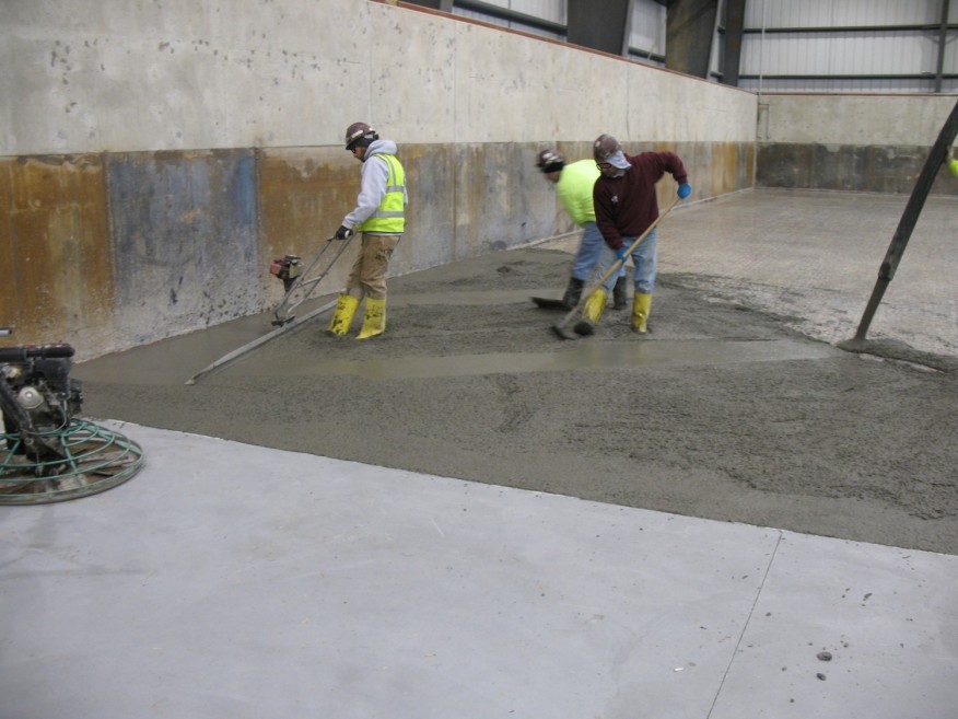 DEALING WITH AMBIENT CONDITIONS WHEN PLACING CONCRETE TOPPINGS (Rain, heat, and cold can all have a negative impact on a topping slab.)